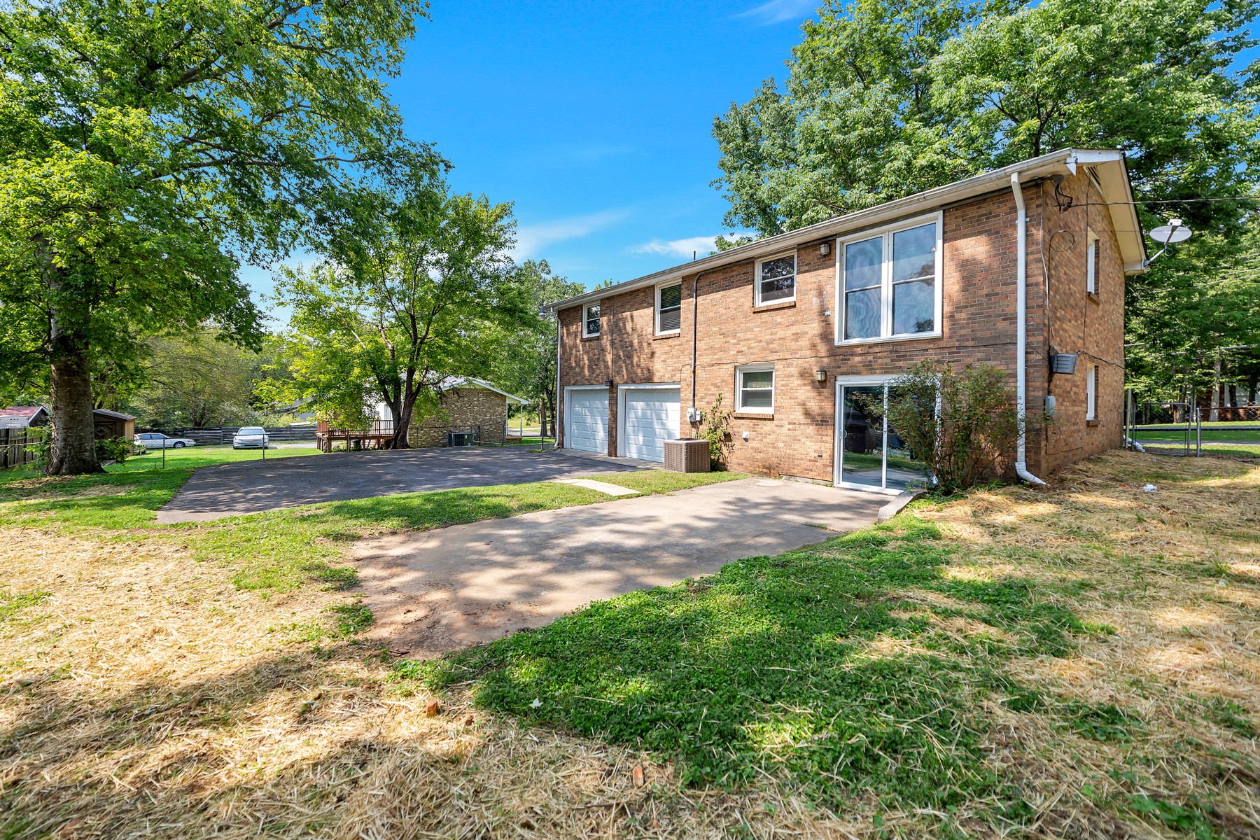 7880 Saundersville Road Mount Juliet, TN 37122 - Photo 24 of 24 a view of a yard with a house and large tree