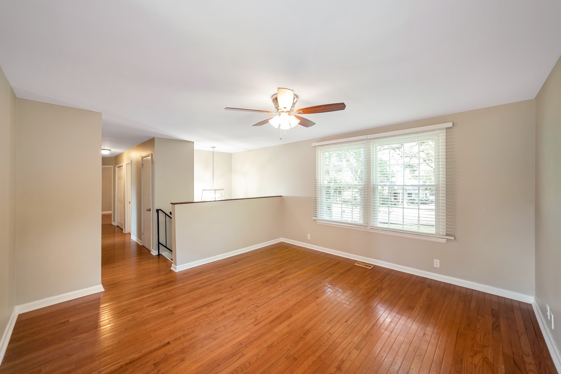 7880 Saundersville Road Mount Juliet, TN 37122 - Photo 4 of 24 a view of an empty room with wooden floor and a window