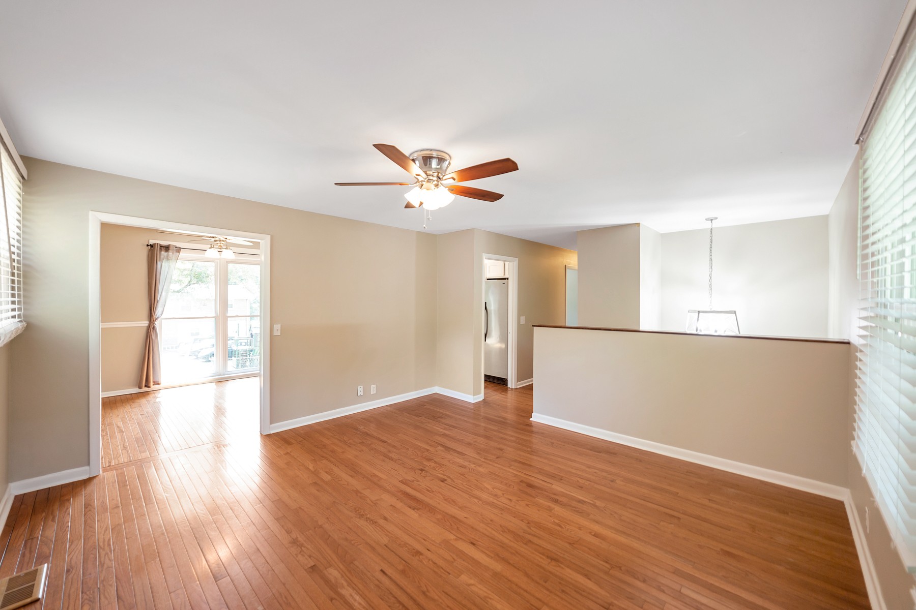 7880 Saundersville Road Mount Juliet, TN 37122 - Photo 5 of 24 a view of an empty room with wooden floor and a window
