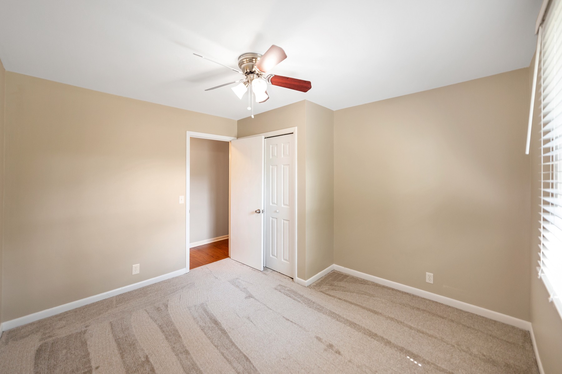 7880 Saundersville Road Mount Juliet, TN 37122 - Photo 10 of 24 a view of an empty room with window and chandelier fan