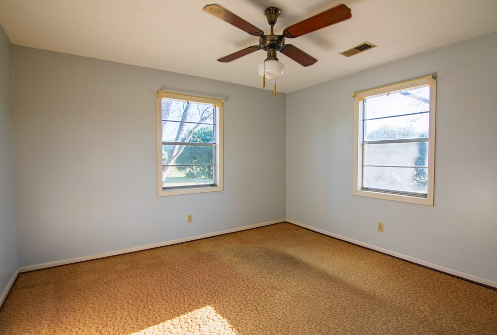30 North G Street Hamilton, GA 31811 - Photo 11 of 35 a view of a big room with windows and chandelier fan