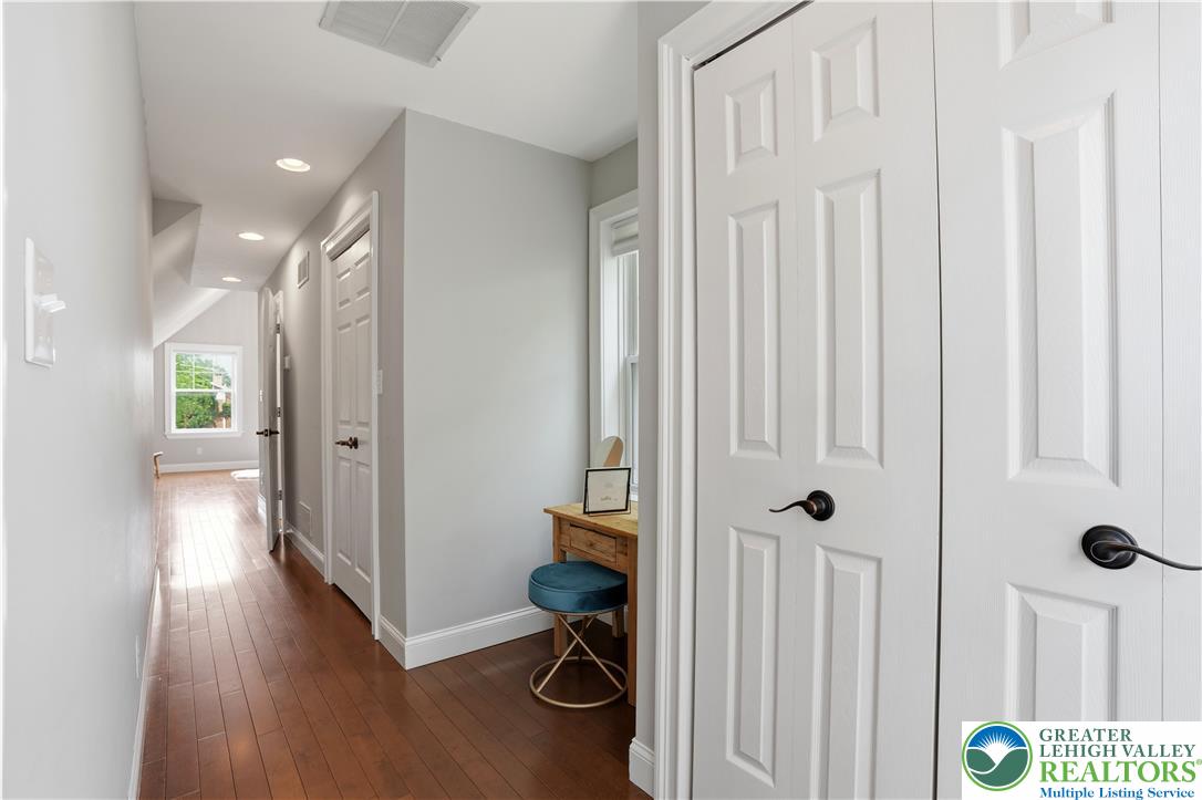 2014 Linden Street Bethlehem, PA 18017 - Photo 35 of 85 A well-lit hallway with hardwood floors leads to bright windows and inviting doorways.