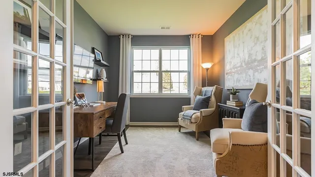 a view of a livingroom with furniture