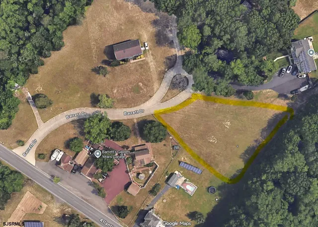 an aerial view of a house with swimming pool