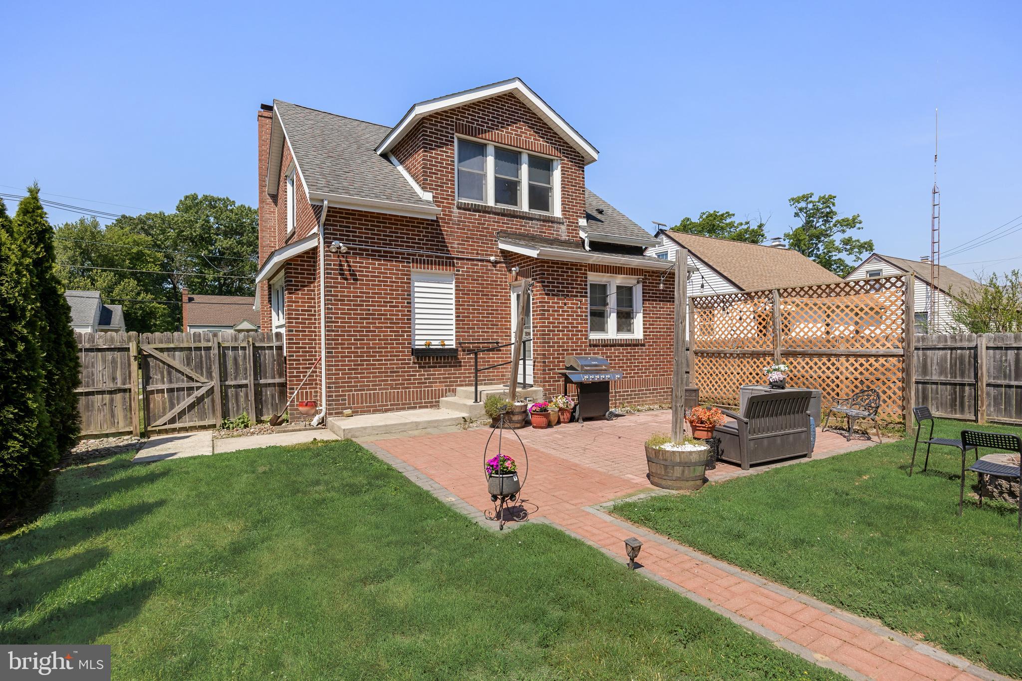 615 North Walnut Avenue Magnolia, NJ 08049 - Photo 27 of 40 a front view of a house with a garden