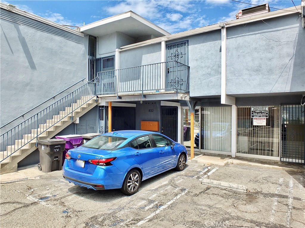 830 Atlantic Avenue Long Beach, CA 90813 - Photo 13 of 75 a front view of a house with a garage