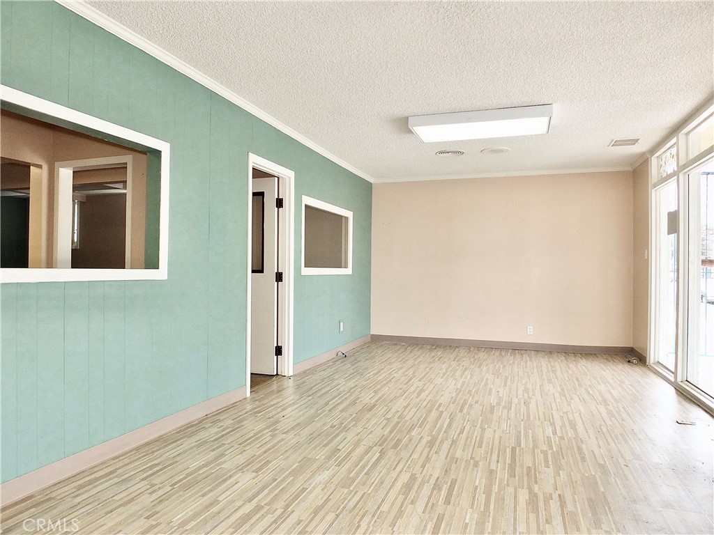 830 Atlantic Avenue Long Beach, CA 90813 - Photo 21 of 75 an empty room with wooden floor and windows