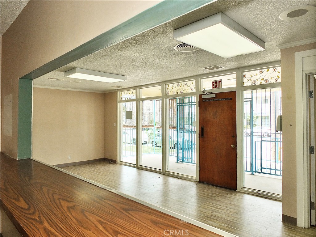 830 Atlantic Avenue Long Beach, CA 90813 - Photo 22 of 75 a view of an empty room with wooden floor and a window