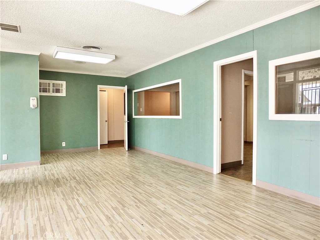 830 Atlantic Avenue Long Beach, CA 90813 - Photo 23 of 75 a view of an empty room with wooden floor and a window