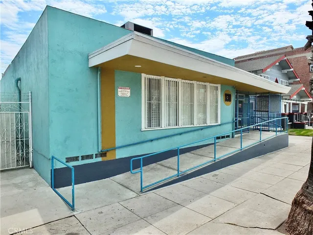 a porch with a table and chairs