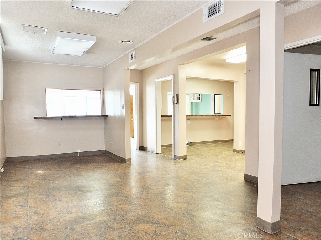 830 Atlantic Avenue Long Beach, CA 90813 - Photo 42 of 75 a view of a big room with wooden floor and a kitchen
