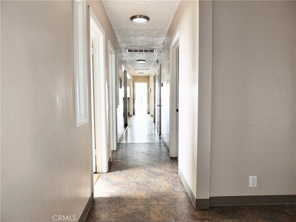 830 Atlantic Avenue Long Beach, CA 90813 - Photo 53 of 75 a view of a hallway with wooden floor and staircase