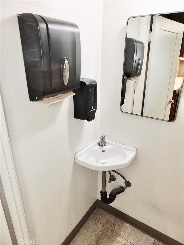 830 Atlantic Avenue Long Beach, CA 90813 - Photo 69 of 75 a bathroom with a sink and mirror