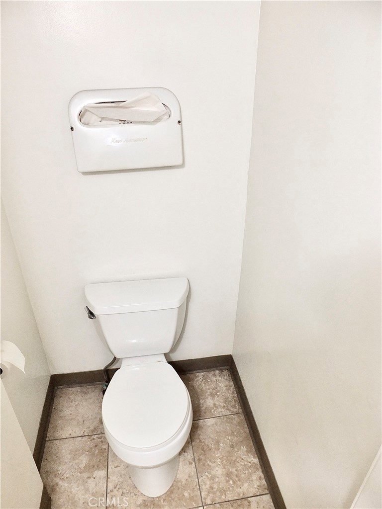 830 Atlantic Avenue Long Beach, CA 90813 - Photo 70 of 75 a bathroom with a toilet and a mirror