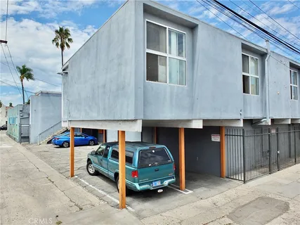 a front view of a house with parking space