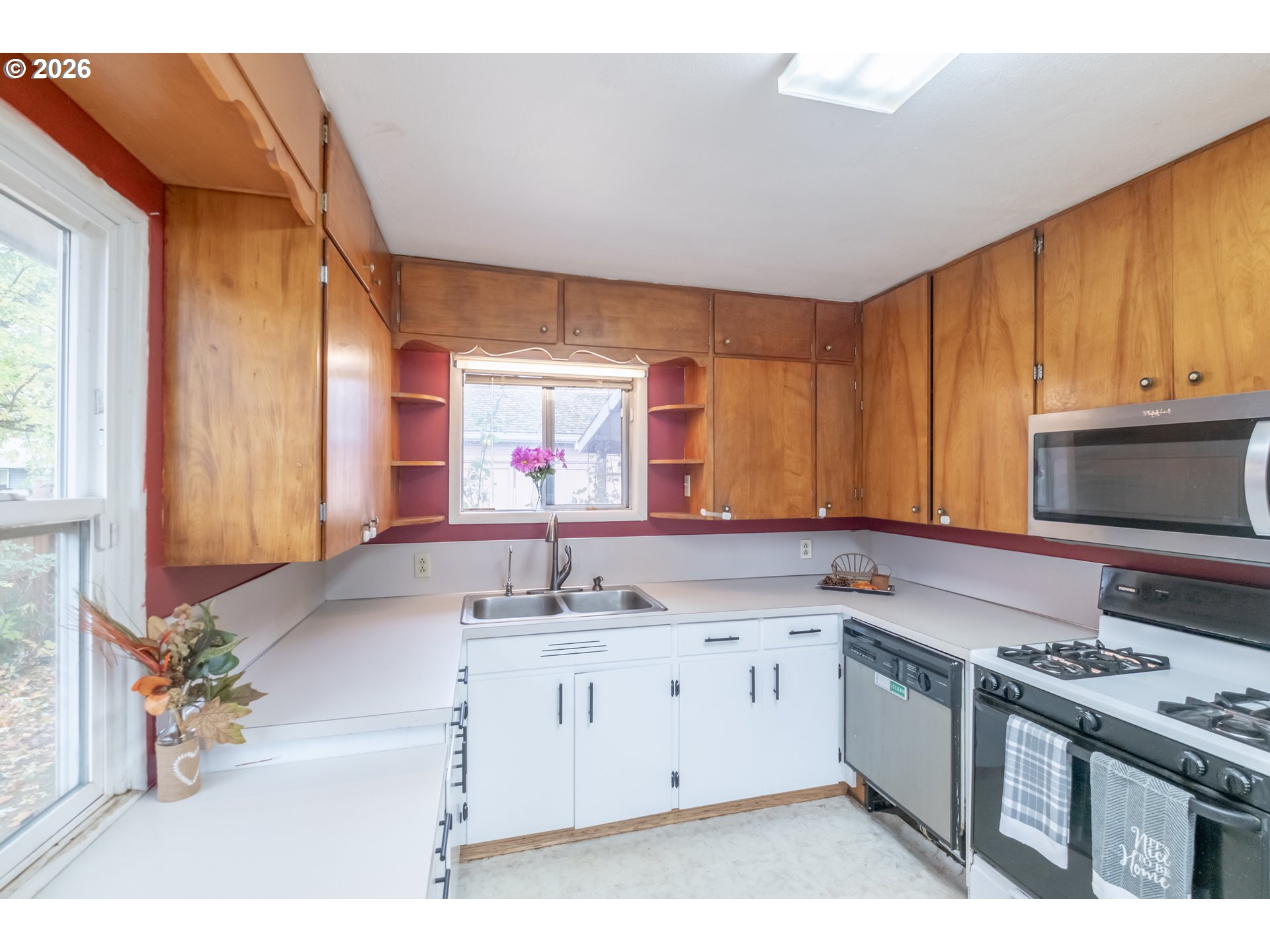 240 South 7th Street Lebanon, OR 97355 - Photo 13 of 27 a kitchen with a sink stove and cabinets
