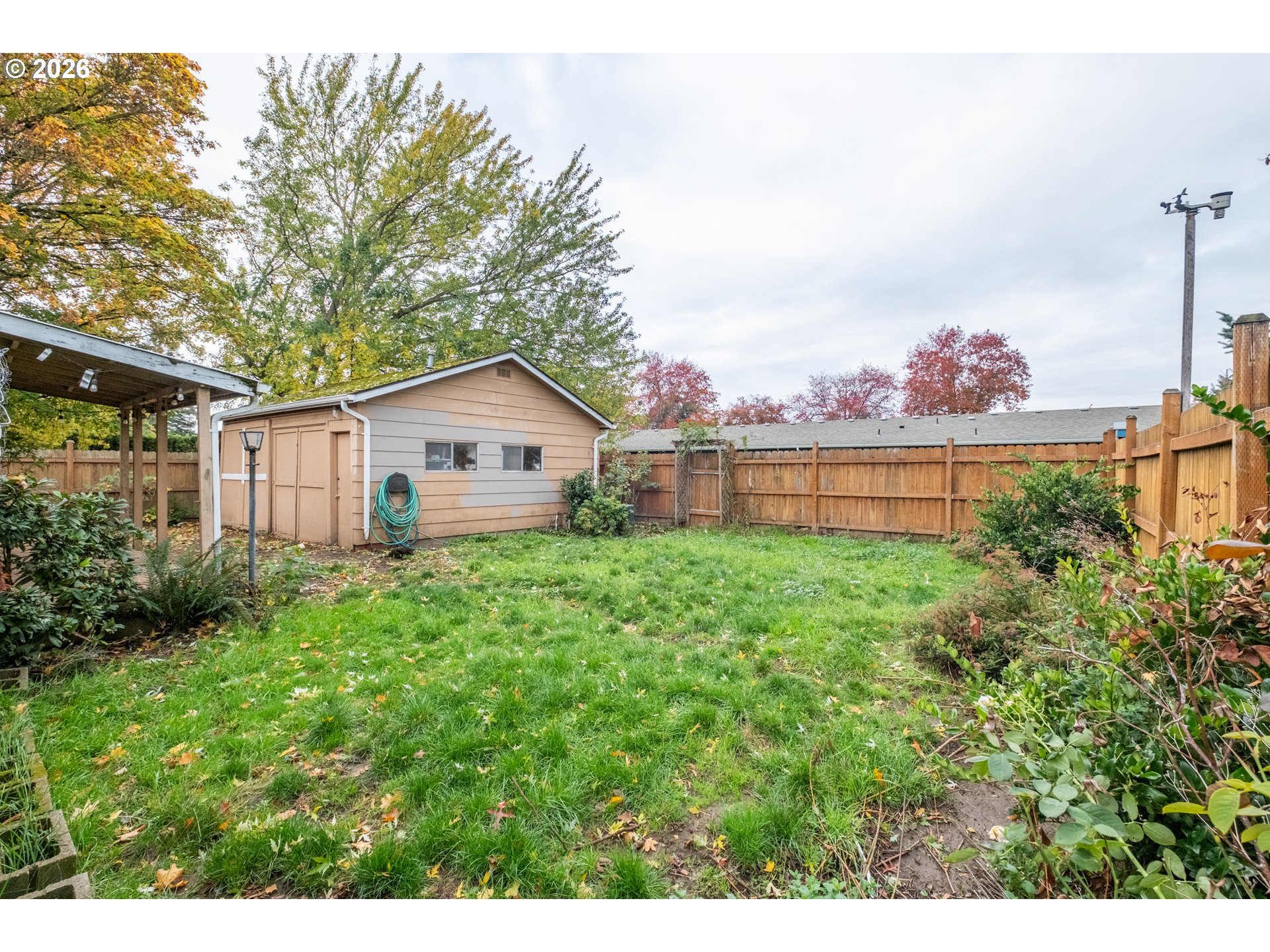 240 South 7th Street Lebanon, OR 97355 - Photo 26 of 27 a view of a house with a yard and potted plants
