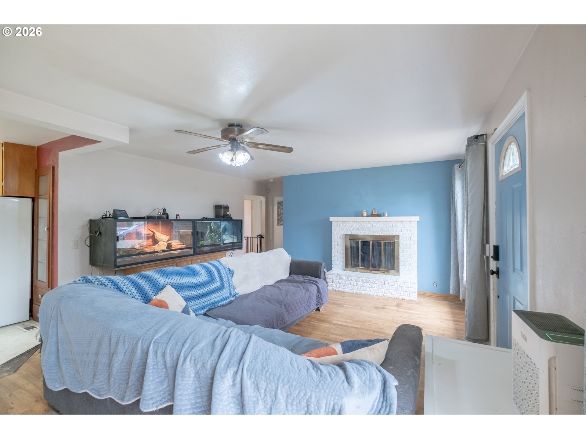 240 South 7th Street Lebanon, OR 97355 - Photo 5 of 27 a bedroom with a large bed and a chandelier
