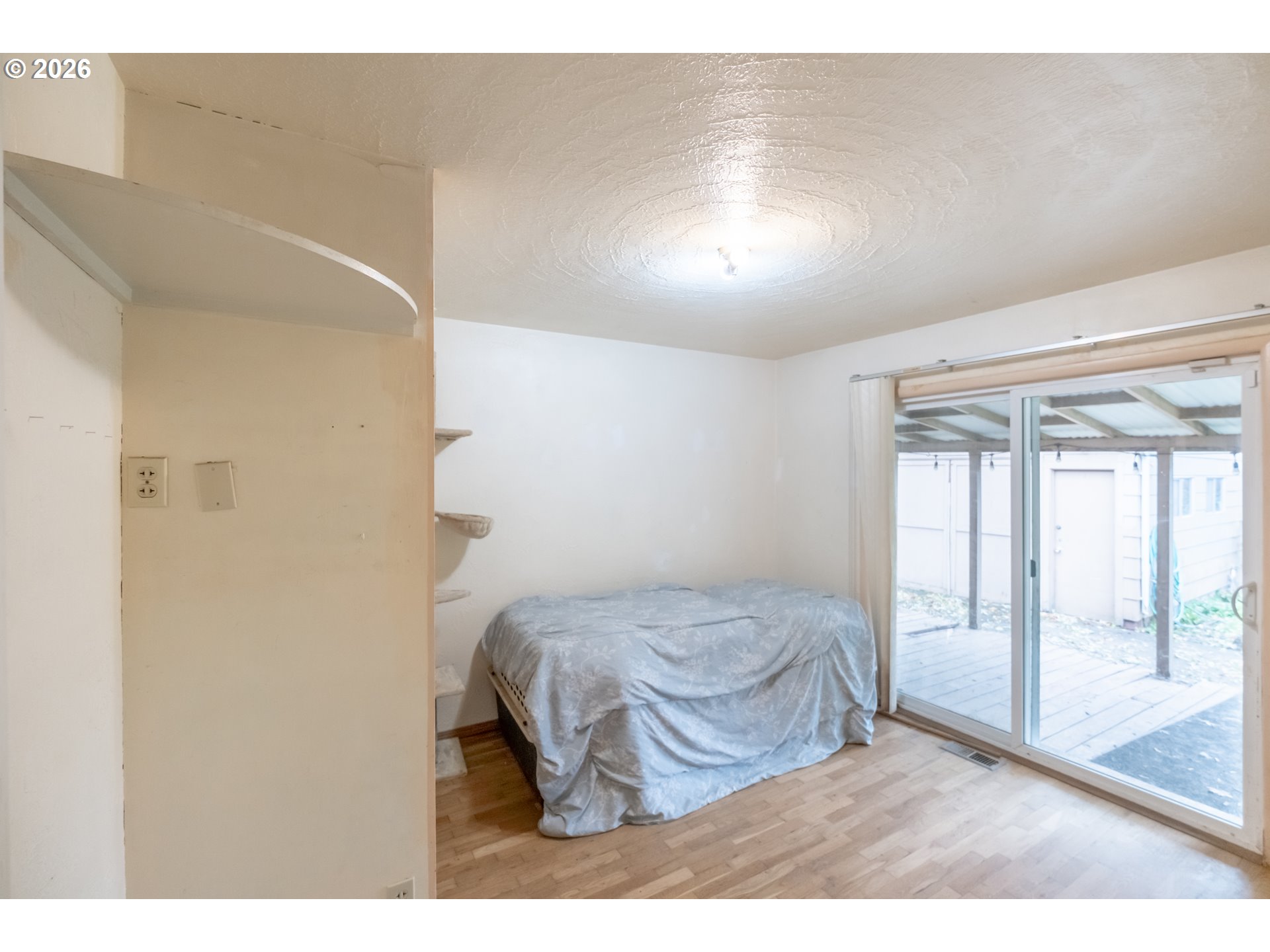 240 South 7th Street Lebanon, OR 97355 - Photo 10 of 27 a bedroom with a bed and a large window