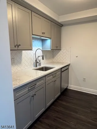 a kitchen with cabinets and window