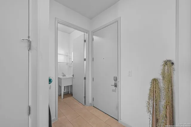 a view of bathroom with a shower and a sink
