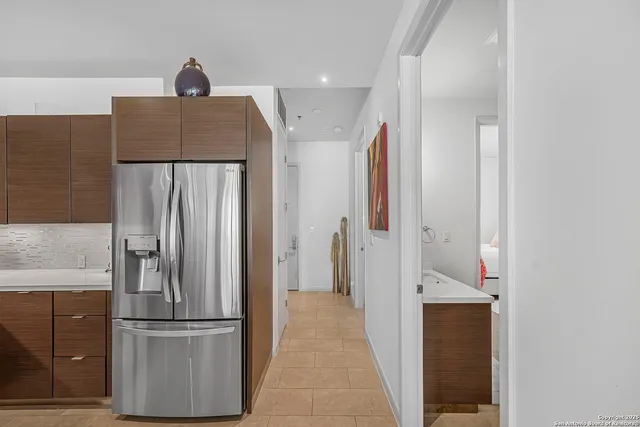 a view of hallway with cabinets