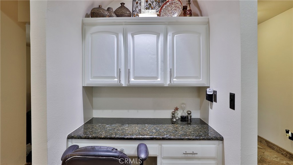 12698 La Solana Drive Redlands, CA 92373 - Photo 20 of 65 a kitchen with granite countertop white cabinets and a granite counter tops