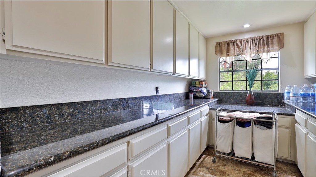 12698 La Solana Drive Redlands, CA 92373 - Photo 23 of 65 a kitchen with a sink and cabinets
