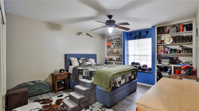 a bedroom with a bed and a cabinets