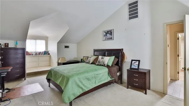 a view of a swimming pool and lounge chairs