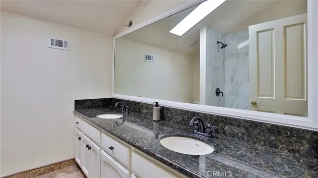 a front view of a house with swimming pool garden and patio