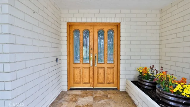 a livingroom with workspace and a couch