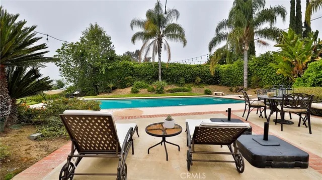 an aerial view of a house with outdoor space