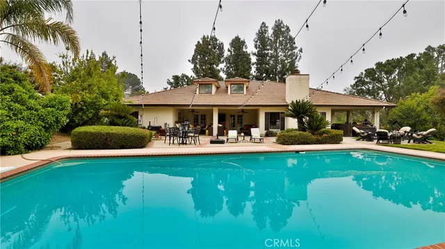an aerial view of a house with a garden