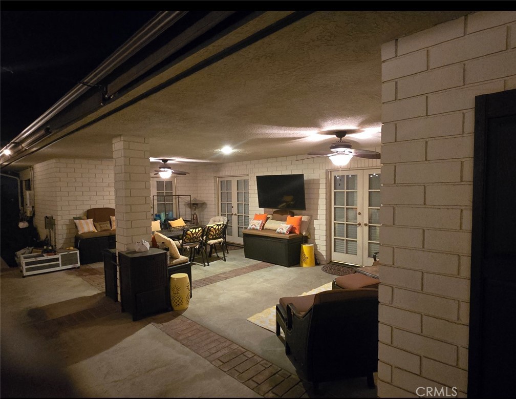 12698 La Solana Drive Redlands, CA 92373 - Photo 56 of 65 a living room with furniture a flat screen tv and a table