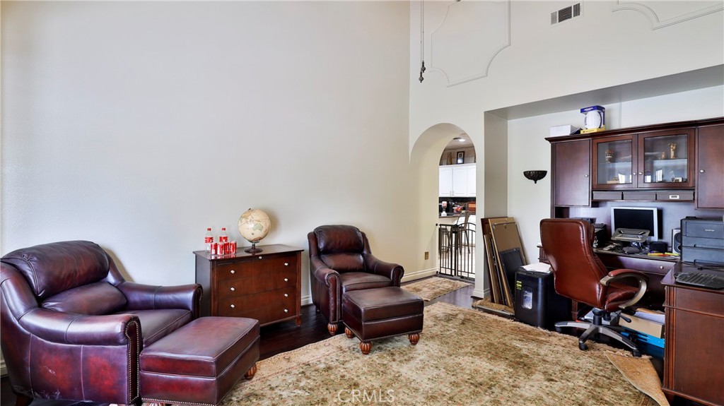 12698 La Solana Drive Redlands, CA 92373 - Photo 6 of 65 a livingroom with workspace and a couch