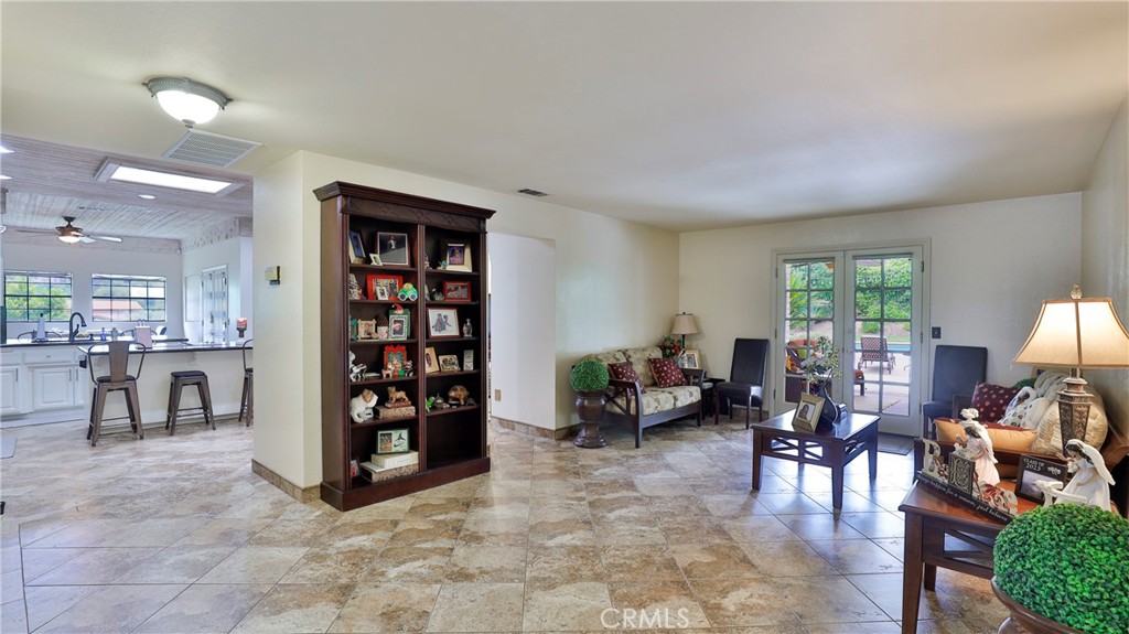 12698 La Solana Drive Redlands, CA 92373 - Photo 8 of 65 a living room with furniture and a flat screen tv