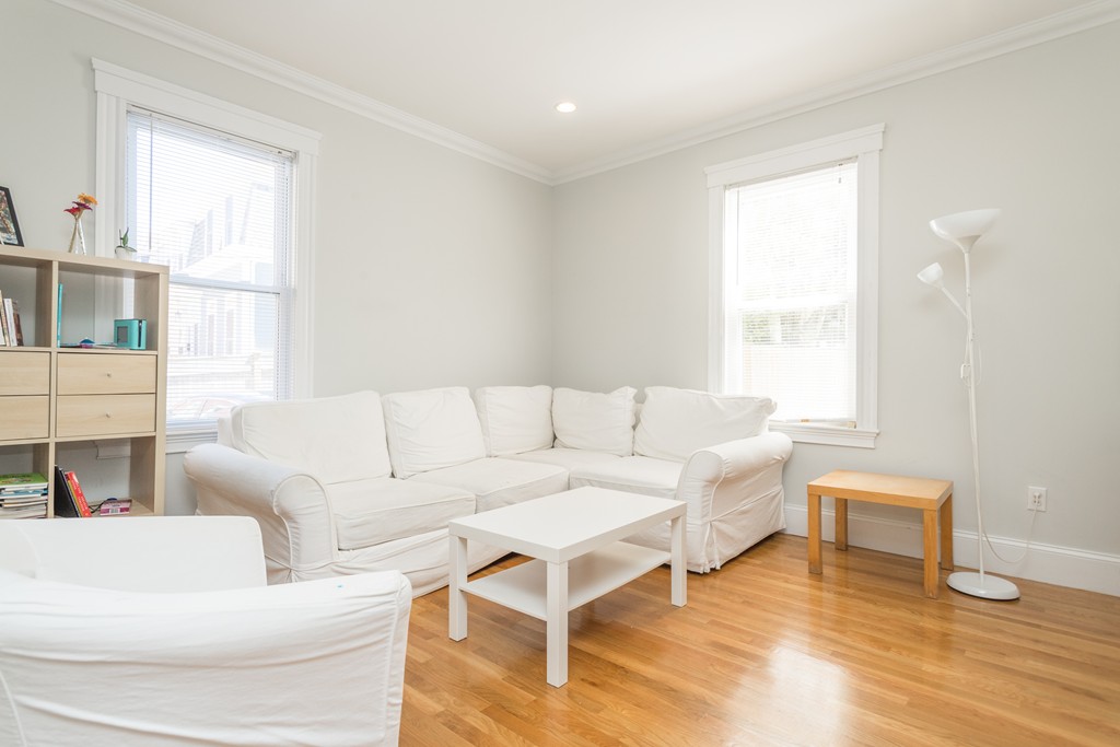 23 Hurd Road, Unit 1 Brookline, MA 02445 - Photo 3 of 12 a living room with furniture and a window
