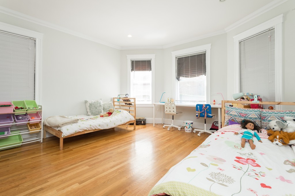 23 Hurd Road, Unit 1 Brookline, MA 02445 - Photo 7 of 12 a bedroom with furniture and a wooden floor