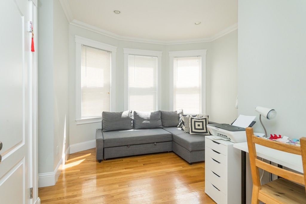 23 Hurd Road, Unit 1 Brookline, MA 02445 - Photo 8 of 12 a living room with furniture and a window