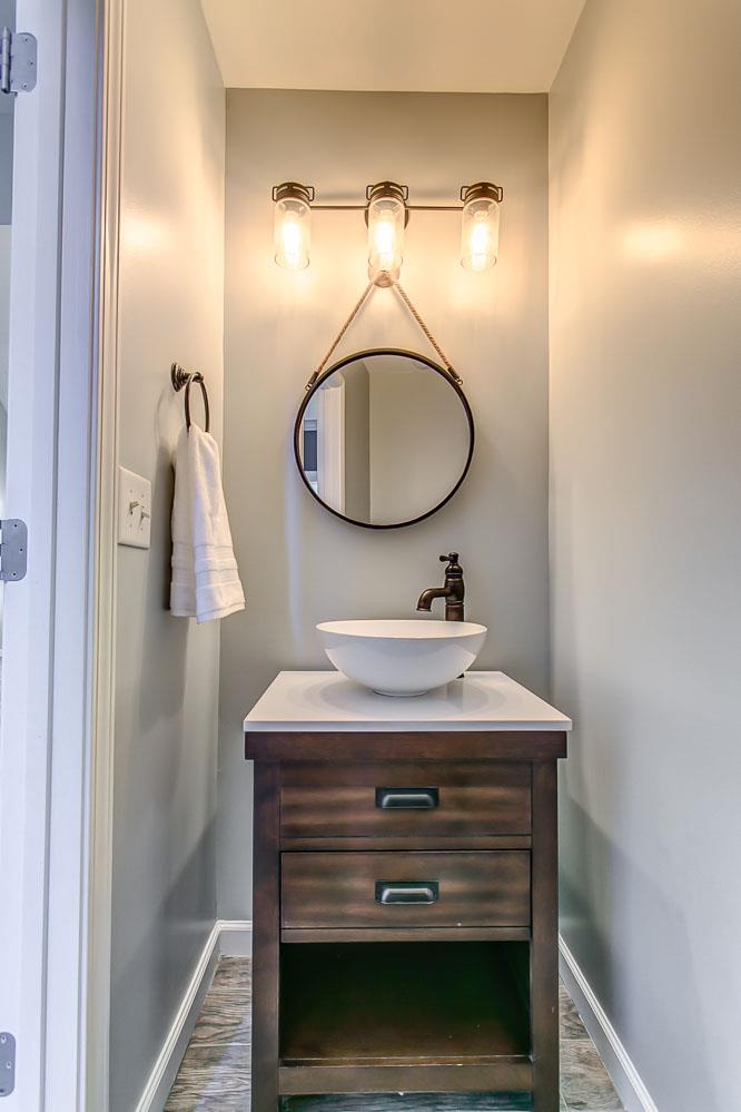 2004 Fiona Way Spring Hill, TN 37174 - Photo 14 of 30 Powder Room with the wash bowl basin, round decorative mirror, and mason jar light fixture fits perfectly with the home.