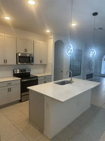 a large kitchen with cabinets