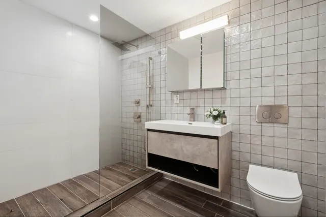 a bedroom with a bed and glass window