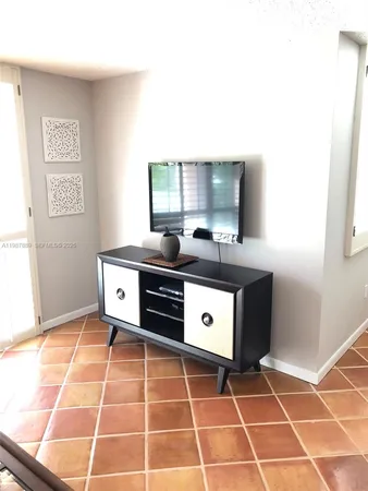 a dining room with a table and chairs
