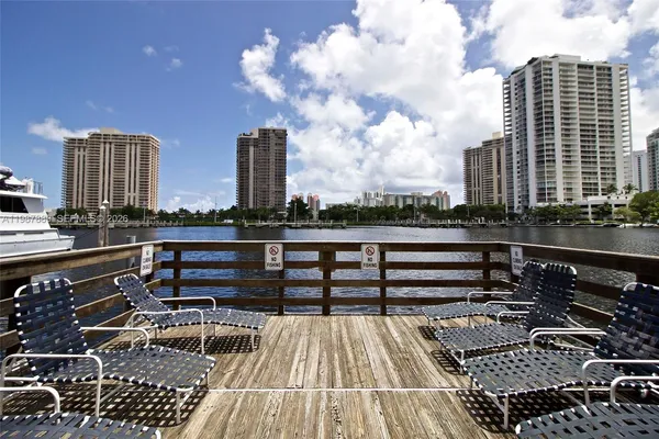 a swimming pool with outdoor seating and yard