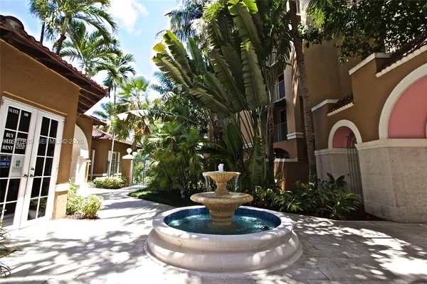 a view of a building with a swimming pool