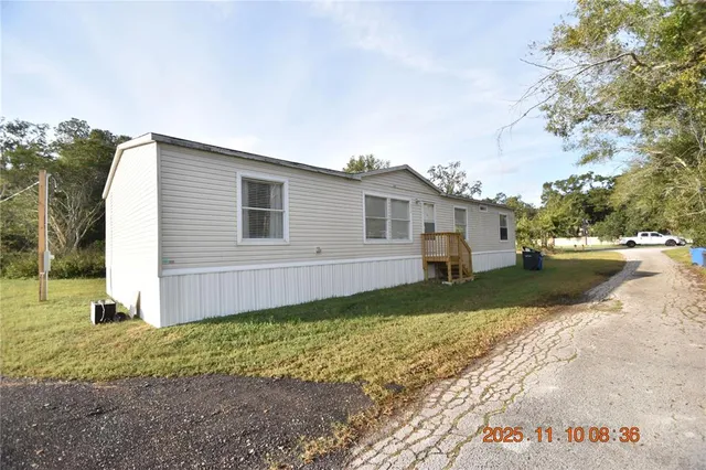 a view of a backyard of the house