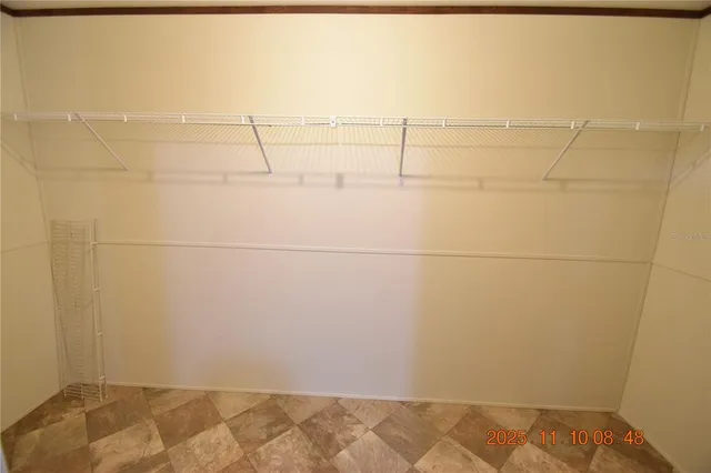 a bathroom with a granite countertop sink a mirror and a shower