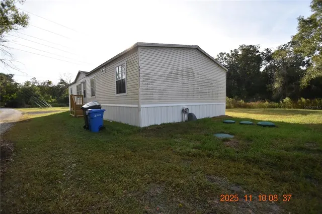 a backyard of a house with lots of green space