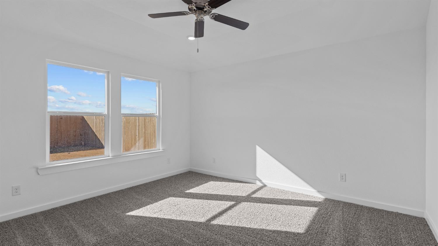 7448 8th Street Lubbock, TX 79416 - Photo 19 of 22 a view of an empty room with a window